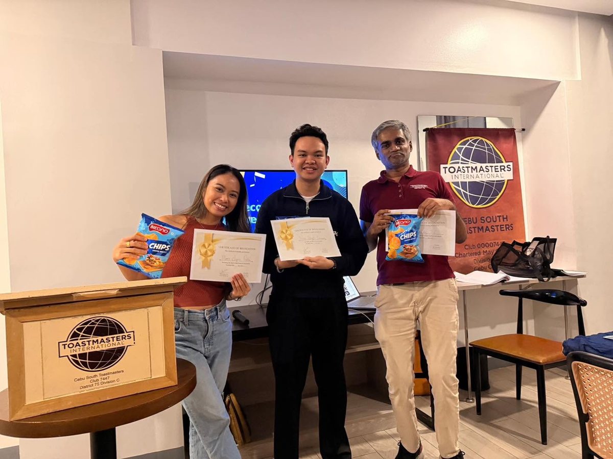 Members holding certificates for completed speech projects